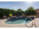 Beautiful in-ground pool with mature landscaping in the backyard at 5641 E Grovers Ave, Scottsdale, AZ 85254