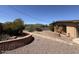 Backyard with brick planters and gravel landscaping at 5829 E Windsor Ave, Scottsdale, AZ 85257