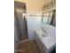Modern bathroom featuring a sink, vanity, mirror, and a shower with glass doors at 5829 E Windsor Ave, Scottsdale, AZ 85257