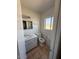 Well-lit bathroom featuring a sink, vanity, and a toilet at 5829 E Windsor Ave, Scottsdale, AZ 85257
