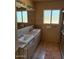 Bright bathroom features double sinks, tiled floors, and a large window at 5829 E Windsor Ave, Scottsdale, AZ 85257