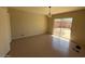 Clean bedroom with sliding glass doors leading to a patio at 5829 E Windsor Ave, Scottsdale, AZ 85257