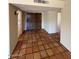 Entryway with tile flooring leads to a wooden door and other areas in the home at 5829 E Windsor Ave, Scottsdale, AZ 85257
