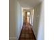 Hallway featuring tile floors and access to multiple rooms in the home at 5829 E Windsor Ave, Scottsdale, AZ 85257
