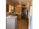A vintage kitchen with unique cabinets, tile floors, and a bright, open atmosphere at 5829 E Windsor Ave, Scottsdale, AZ 85257