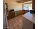 A vintage kitchen with unique colored cabinets, tile floors, and a bright, open atmosphere at 5829 E Windsor Ave, Scottsdale, AZ 85257
