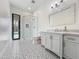 White bathroom featuring a modern vanity, glass shower, decorative tile, and outdoor access at 6129 E Turquoise Ave, Paradise Valley, AZ 85253