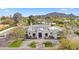 Stunning home featuring meticulous landscaping, lush greenery and a circular driveway for a grand arrival at 6129 E Turquoise Ave, Paradise Valley, AZ 85253