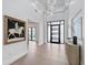 Bright foyer with sleek hardwood floors, modern lighting, and stunning decor at 6129 E Turquoise Ave, Paradise Valley, AZ 85253