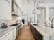 Well-appointed kitchen features a large island, professional-grade appliances, and sleek marble countertops at 6129 E Turquoise Ave, Paradise Valley, AZ 85253