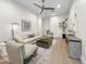 Cozy living room featuring modern decor, wood floors, comfortable seating, and natural light at 6129 E Turquoise Ave, Paradise Valley, AZ 85253