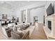 Bright, open-concept living room featuring high ceilings, modern furnishings, and seamless access to the kitchen at 6129 E Turquoise Ave, Paradise Valley, AZ 85253