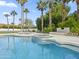 Beautiful pool with cascading hot tub, travertine deck, and desert landscaping at 6129 E Turquoise Ave, Paradise Valley, AZ 85253