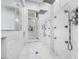 Luxurious walk-in shower with multiple shower heads, mosaic tile, and glass enclosure at 6129 E Turquoise Ave, Paradise Valley, AZ 85253