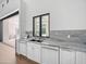 Stylish wet bar offers ample storage, marble countertop, and convenient access to outdoor space at 6129 E Turquoise Ave, Paradise Valley, AZ 85253
