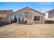 A large backyard featuring a covered patio, perfect for outdoor gatherings and relaxation at 7329 W Lamar Rd, Glendale, AZ 85303