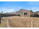 Spacious backyard with a covered patio, offering ample space for outdoor activities at 7329 W Lamar Rd, Glendale, AZ 85303