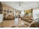 Bright living room showcasing neutral walls, comfortable sofas, and a vaulted ceiling at 7329 W Lamar Rd, Glendale, AZ 85303