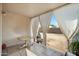 A covered patio with a tile floor and white curtain panels offers a private outdoor space at 7329 W Lamar Rd, Glendale, AZ 85303