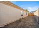 Side yard with a gate to the backyard and offering space for privacy and utility at 7329 W Lamar Rd, Glendale, AZ 85303