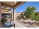 Outdoor backyard area complete with built-in BBQ grill, and low-maintenance landscaping at 7589 W Quail Track Dr, Peoria, AZ 85383