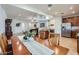 Dining area with a large wooden table, seating for eight, and direct access to the living room at 7589 W Quail Track Dr, Peoria, AZ 85383