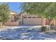 Charming single-Gathering home featuring a two-car garage, well-maintained landscaping, and a welcoming front entrance at 7589 W Quail Track Dr, Peoria, AZ 85383