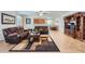 Open-concept living room seamlessly connected to the kitchen and dining area, perfect for entertaining at 7589 W Quail Track Dr, Peoria, AZ 85383