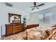 Spacious main bedroom featuring laminate floors, a large window, and plenty of natural light at 7589 W Quail Track Dr, Peoria, AZ 85383