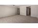Bright bedroom with neutral carpet and paint, and direct access to an ensuite bathroom at 7843 E Valley View Rd, Scottsdale, AZ 85250