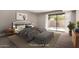 This bedroom boasts carpet floors, neutral tones, and sliding glass doors to let in plenty of light at 7843 E Valley View Rd, Scottsdale, AZ 85250
