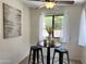 Charming breakfast nook with a round table and seating beneath a ceiling fan at 7843 E Valley View Rd, Scottsdale, AZ 85250