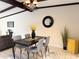 Open dining room with overhead light fixture and views to the living room at 7843 E Valley View Rd, Scottsdale, AZ 85250