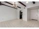Open dining room with tile floors and decorative chandelier in a modern home with convenient access to the kitchen at 7843 E Valley View Rd, Scottsdale, AZ 85250