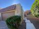 Charming single-story home features a well-maintained front yard, two-car garage, and tiled roof under a clear blue sky at 7843 E Valley View Rd, Scottsdale, AZ 85250