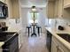 Bright kitchen with updated appliances and a breakfast nook with seating at 7843 E Valley View Rd, Scottsdale, AZ 85250