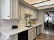 Kitchen featuring white cabinets, quartz counters and stainless steel appliances at 7843 E Valley View Rd, Scottsdale, AZ 85250