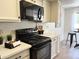 This home features a lovely kitchen with modern appliances and white countertops at 7843 E Valley View Rd, Scottsdale, AZ 85250
