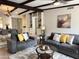 Open living room features beamed ceilings, neutral paint, and modern furnishings at 7843 E Valley View Rd, Scottsdale, AZ 85250
