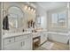 Luxurious bathroom with double vanity, tub, and modern finishes at 8154 E Jaeger St, Mesa, AZ 85207