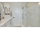 Modern bathroom with a glass shower enclosure and white vanity at 8154 E Jaeger St, Mesa, AZ 85207