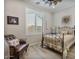 Cozy bedroom featuring a decorative bed frame, wood floors, and plantation shutters at 8154 E Jaeger St, Mesa, AZ 85207