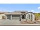 Beautiful home featuring a spacious three-car garage and professionally landscaped front yard with great curb appeal at 8154 E Jaeger St, Mesa, AZ 85207