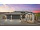 Beautiful home featuring a spacious three-car garage and professionally landscaped front yard with great curb appeal at 8154 E Jaeger St, Mesa, AZ 85207