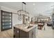 Open kitchen layout with granite countertops, stainless steel appliances, and dining area access at 8154 E Jaeger St, Mesa, AZ 85207