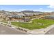Scenic community view featuring a green space with mountain views in the background at 8154 E Jaeger St, Mesa, AZ 85207