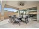 Covered patio with outdoor dining set and view of backyard at 8154 E Jaeger St, Mesa, AZ 85207