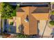 Aerial view of the house with a brown roof, a well maintained yard, and a patio at 8656 E Plaza Ave, Scottsdale, AZ 85250