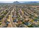 Aerial view of a neighborhood with mature trees, single-Gathering homes, and mountain views at 8656 E Plaza Ave, Scottsdale, AZ 85250