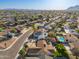 Aerial view of a neighborhood with mature trees, single-Gathering homes, and mountain views at 8656 E Plaza Ave, Scottsdale, AZ 85250